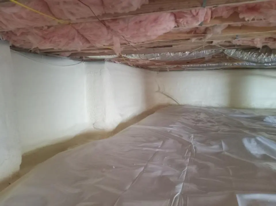 Crawl space encapsulation with closed-cell spray foam for Commercial Roof Restoration in Clanton